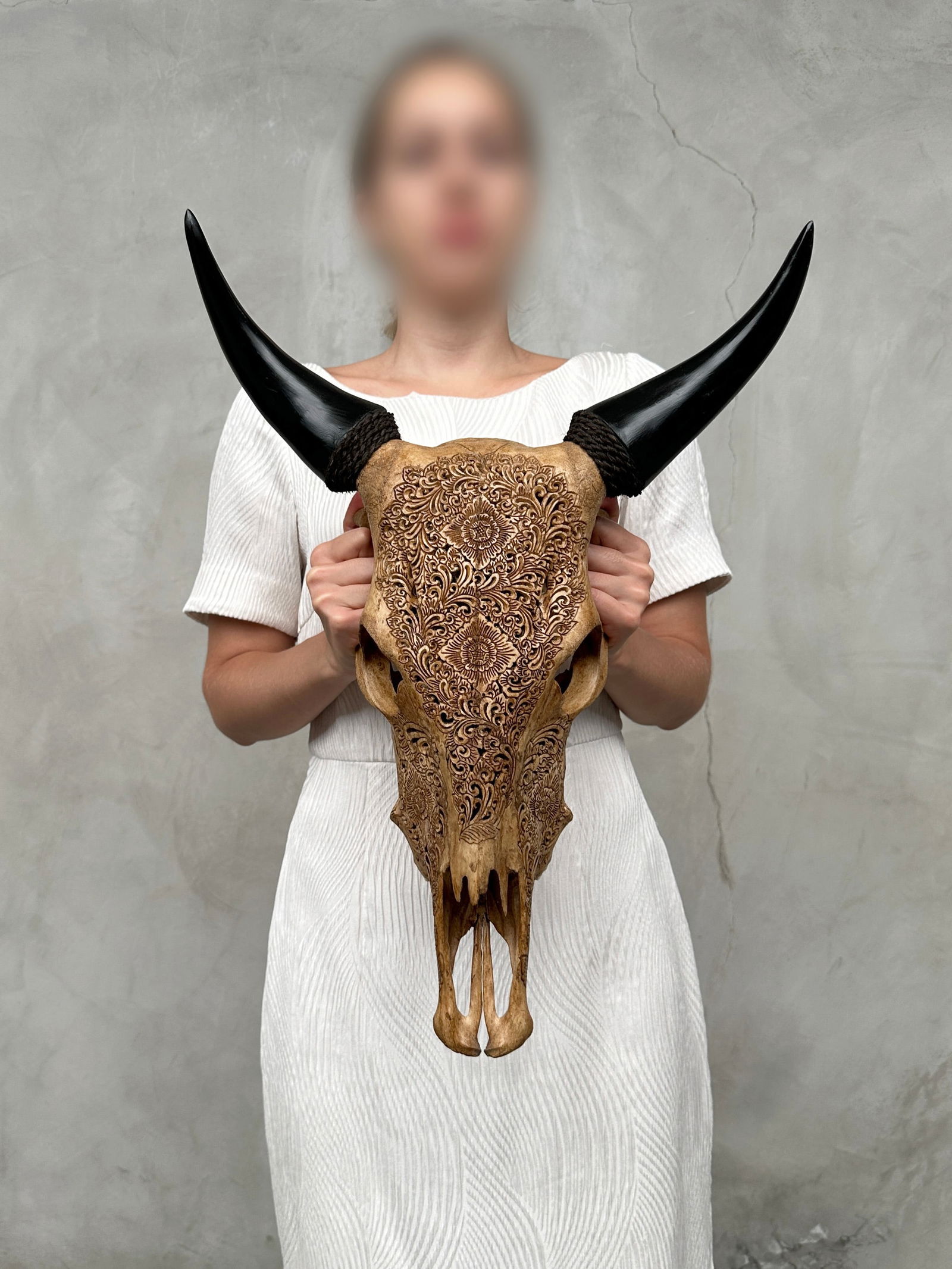 Brown cow skull - Traditional Balinese motif: Title: Brown cow skull - Traditional Balinese motifMaker:UnknownOrigin: IndonesiaDate/Period:2025Materials:Bos Taurus, Bone, HornDimensions:Height: 54 cm / 21.2 inches Width: 41 cm / 16.1