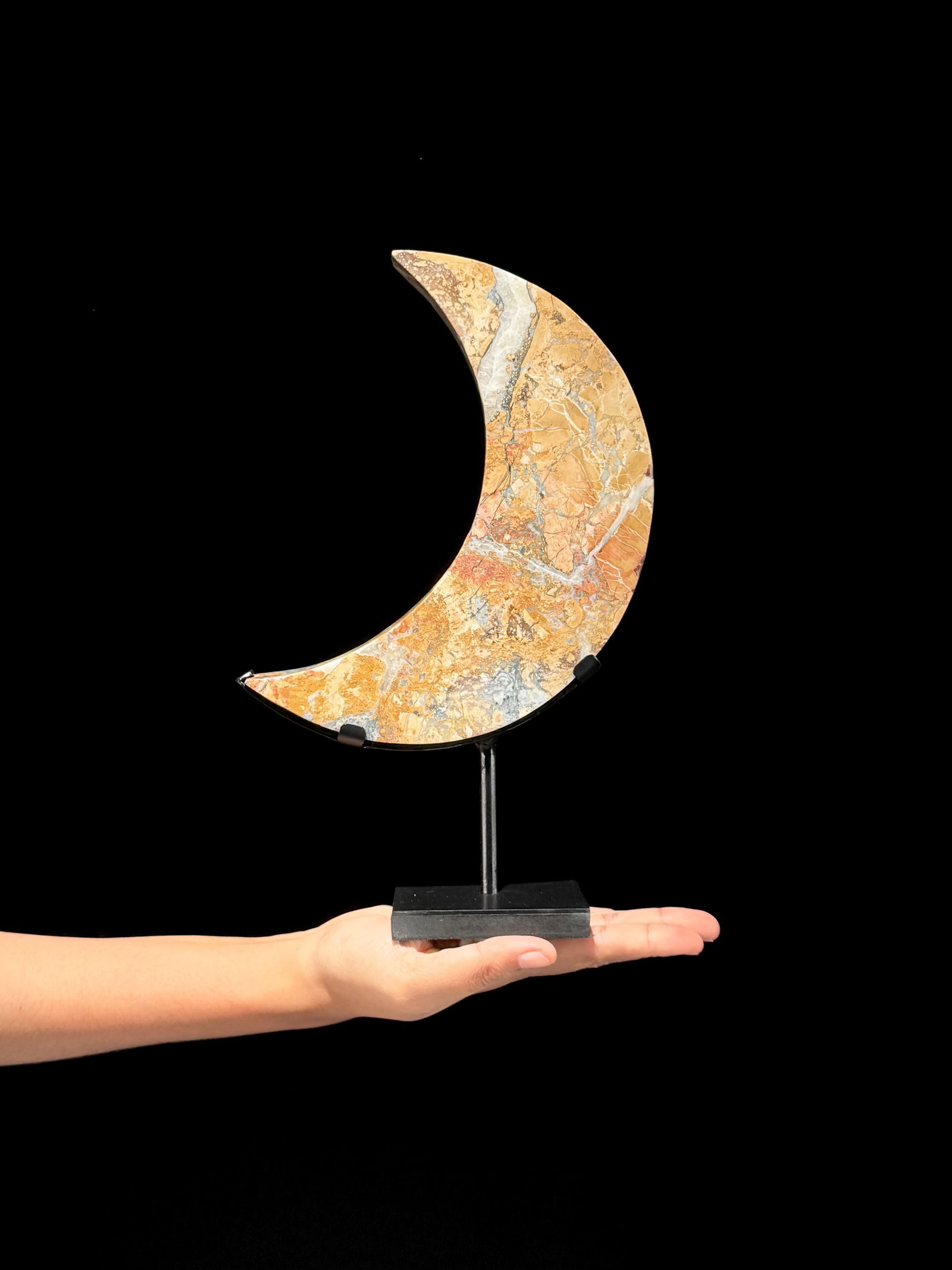 Beautiful crystalized Maligano Jasper Crescent Moon on a custom stand: Title: Beautiful crystalized Maligano Jasper Crescent Moon on a custom standMaker:UnknownOrigin: IndonesiaDate/Period:2025Materials:Maligano Jasper, steelDimensions:Height including stand: 28.2 cm /