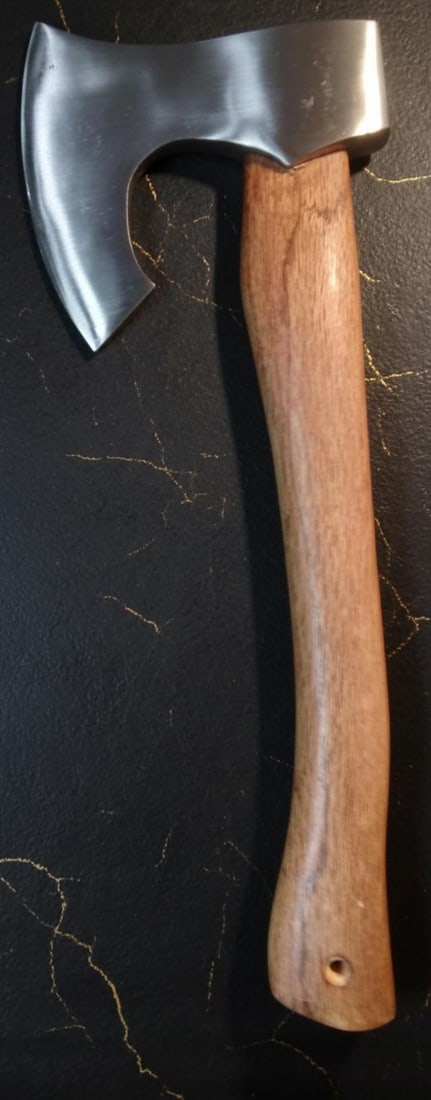 Polished Viking Style Hunting Axe with a Solid Hardwood Handle: Title:Polished Viking Style Hunting Axe with a Solid Hardwood HandleDescription:Discover this new Viking style axe, an excellent tool for outdoor activities such as camping and hunting. This piece