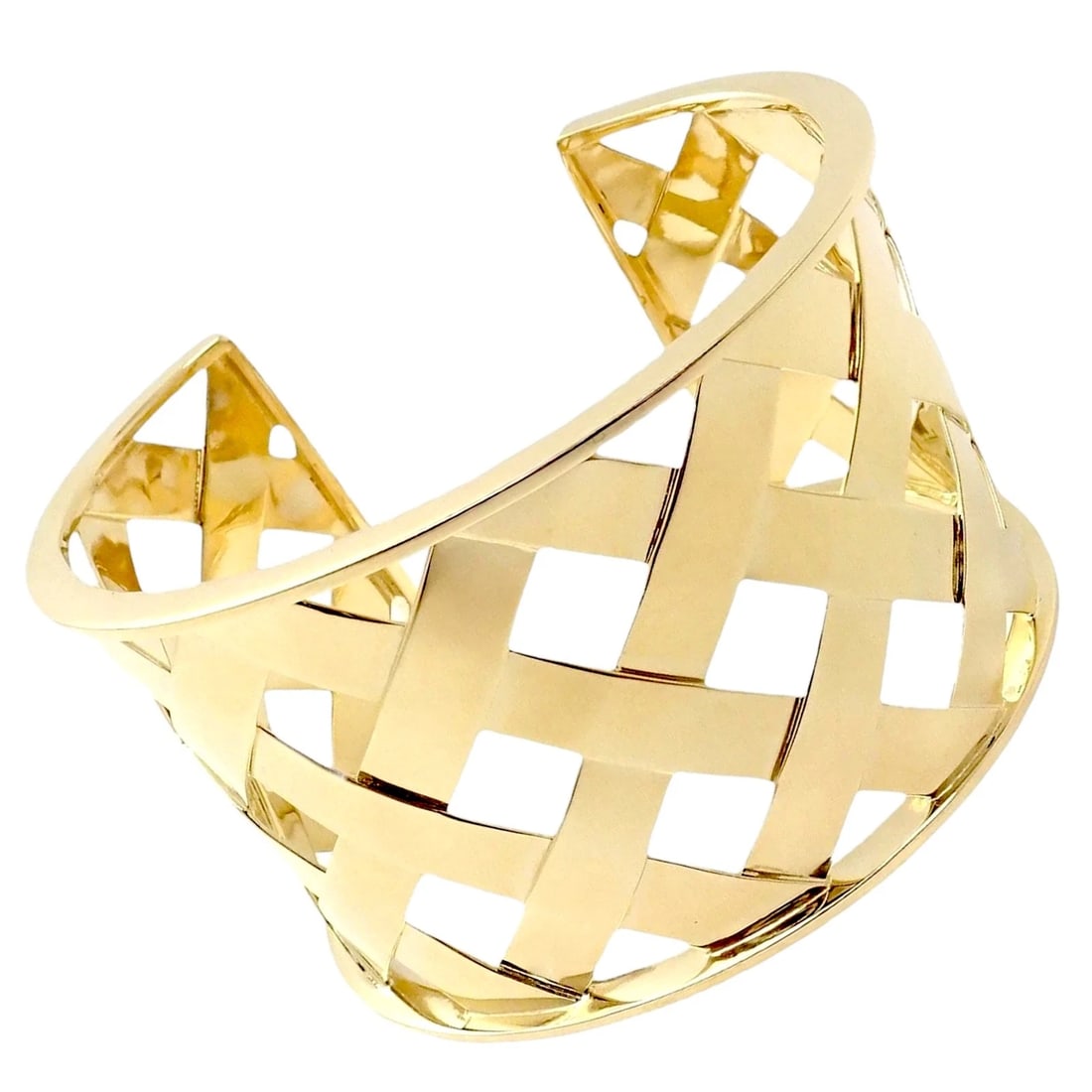 Authentic Verdura 18k Yellow Gold Criss Cross Wide Cuff Bracelet: Handcrafted in 18k yellow gold, this Verdura Criss Cross Wide Cuff Bracelet exemplifies iconic style. Sculptural lines overlay a bold silhouette, blending understated elegance with modern appeal. A tr