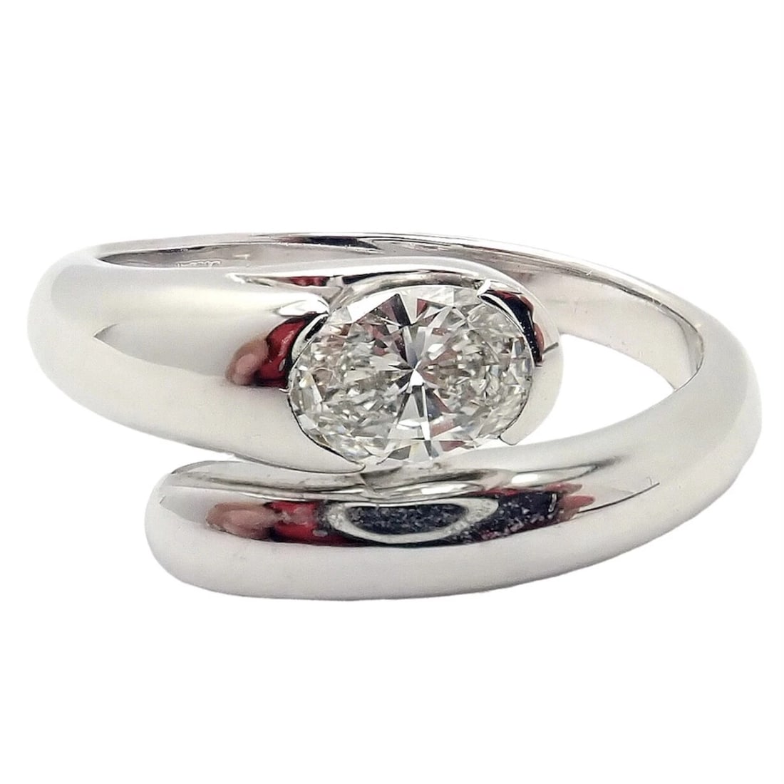 Authentic! Bulgari Bvlgari 18k White Gold Diamond Bypass Band Ring: Authentic! Bulgari Bvlgari 18k White Gold Diamond Bypass Band Ring About This Piece: Metal: 18k White Gold Ring size: 6.25 Weight: Width: 5.7 grams 10mm Stones: 1 Oval brilliant cut diamonds VS1 clari