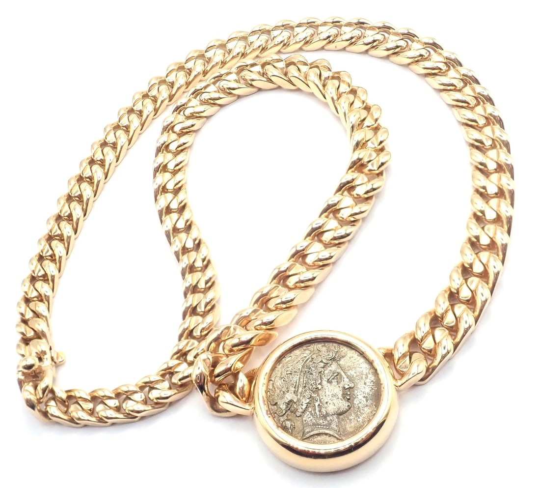 Rare! Bvlgari Bulgari 18k Yellow Gold Antique Coin Monete Link Necklace: Rare! Bvlgari Bulgari 18k Yellow Gold Antique Coin Monete Link Necklace About This Piece: The Bvlgari 18k Yellow Gold Antique Coin Monete Link Necklace showcases ancient coin set within a classic gold