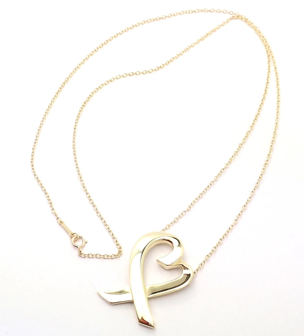 Authentic! Tiffany & Co Picasso 18k Yellow Gold Large Heart Pendant Necklace: Authentic! Tiffany & Co Picasso 18k Yellow Gold Large Heart Pendant Necklace About This Piece: Metal: 18k Yellow Gold Measurements: Length: 25" Width: 2mm Weight: 9.9 grams Pendant: 1.5" X 1" Hallmark