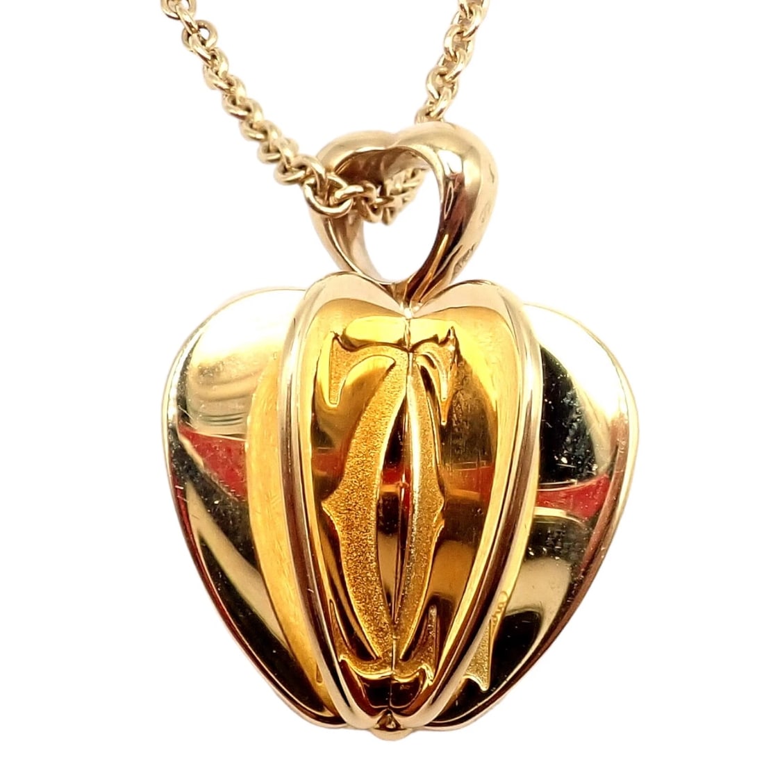 Rare! Cartier 18k Yellow Gold Double C 3D Apple Pendant Chain Necklace: Rare! Cartier 18k Yellow Gold Double C 3D Apple Pendant Chain Necklace About This Piece: The Rare Cartier 18k Yellow Gold Double C 3D Apple Pendant Chain Necklace is a luxurious and unique piece. Feat