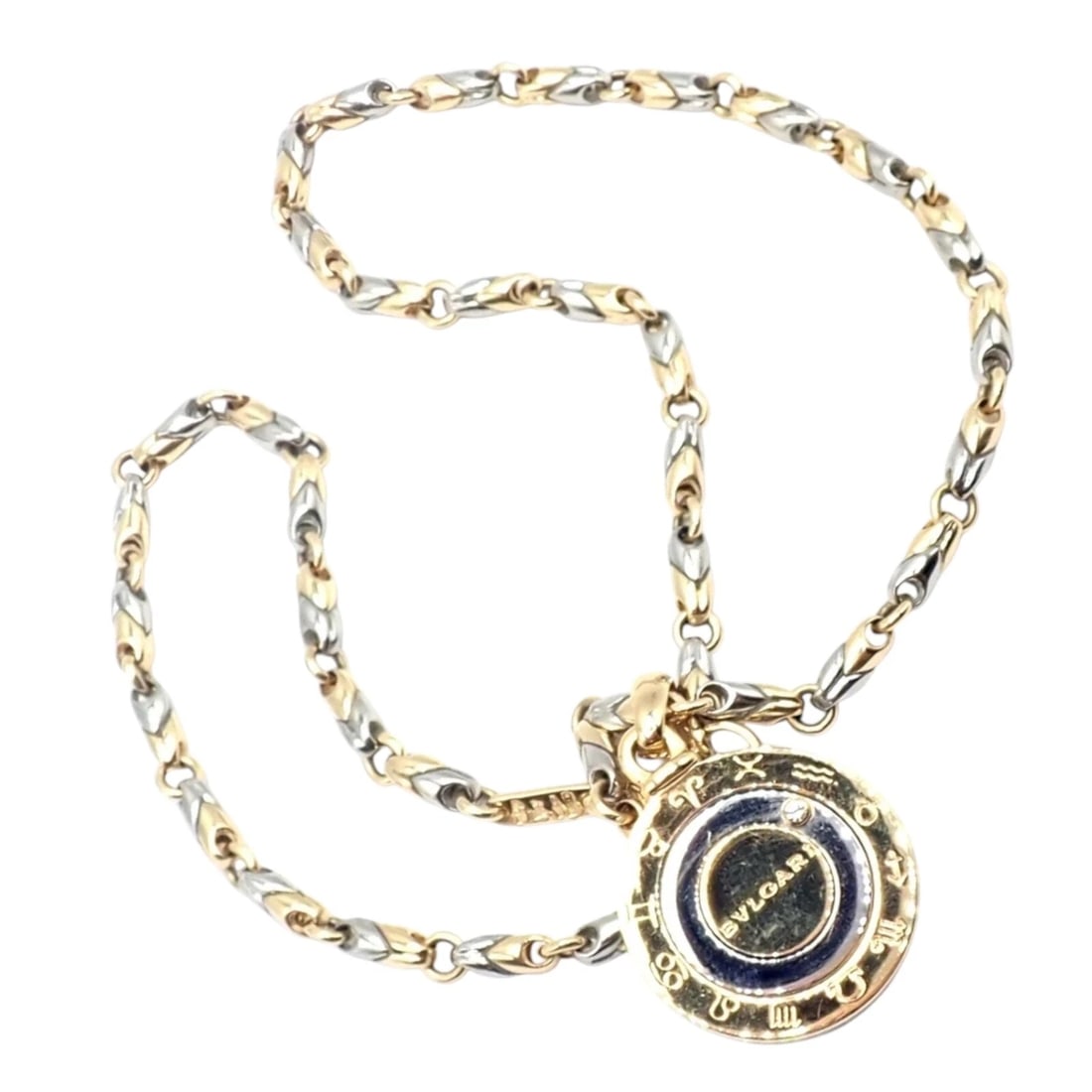 Authentic! Bulgari Bvlgari 18k Yellow Gold Steel Diamond Zodiac Pendant Necklace: Authentic! Bulgari Bvlgari 18k Yellow Gold Steel Diamond Zodiac Pendant Necklace About This Piece: The Bulgari Bvlgari Zodiac Pendant Necklace combines 18k yellow gold, stainless steel, and a brillian