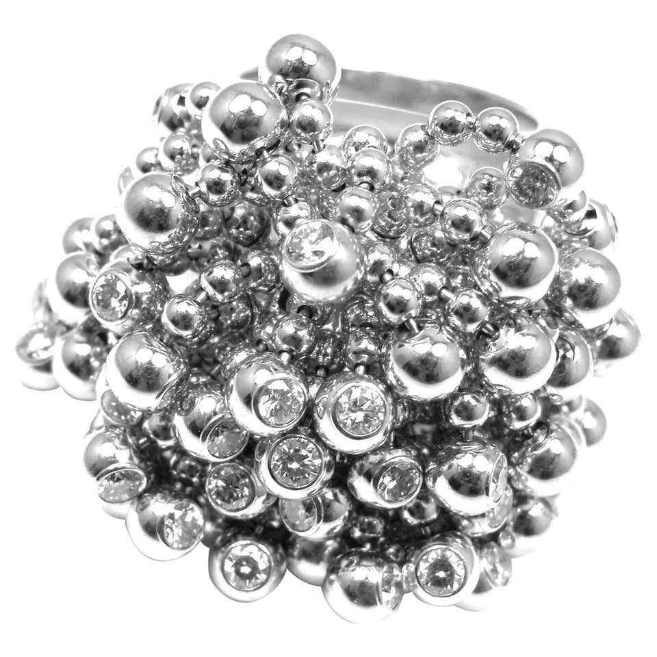 Authentic! Cartier Perruque Paris Nouvelle Vague 18k Gold Diamond Ring Paper: Authentic! Cartier Perruque Paris Nouvelle Vague 18k Gold Diamond Ring Paper About This Piece: This ring comes with original Cartier paper and Cartier box. Metal: 18k White Gold Measurements: Width: 2