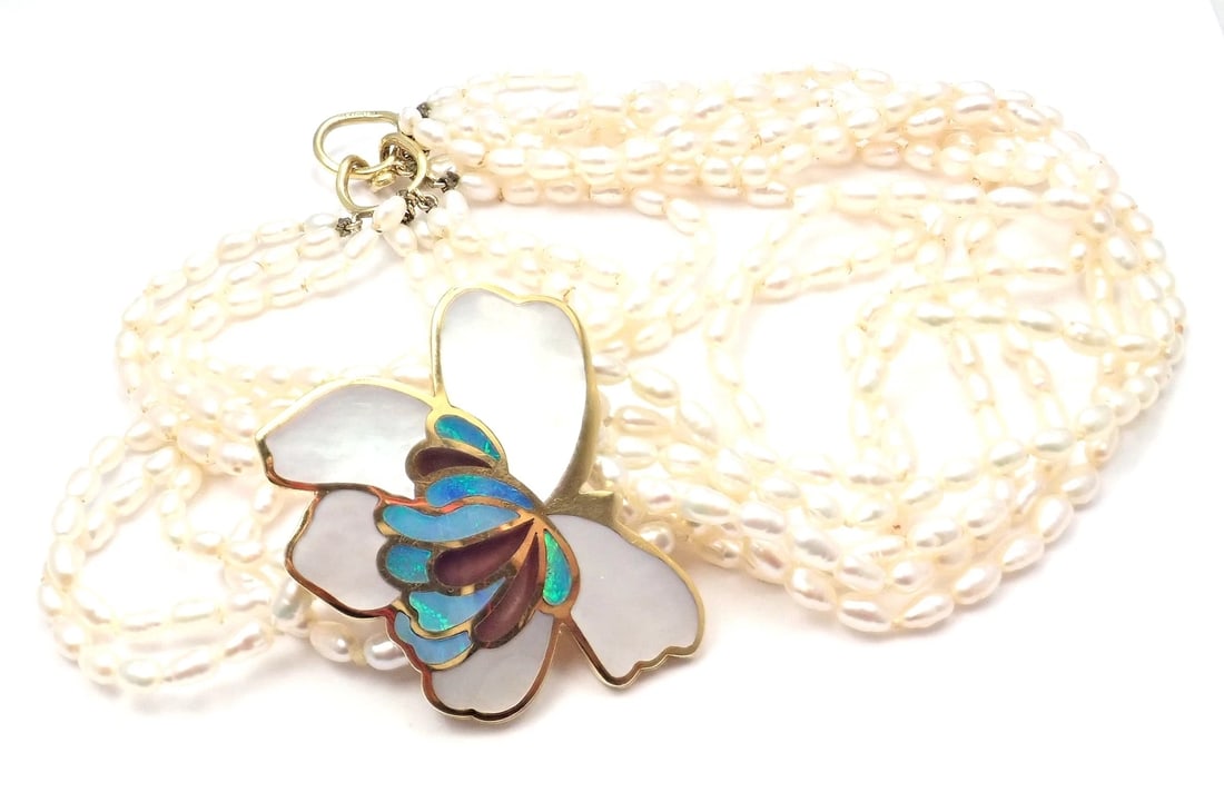 Authentic! Tiffany & Co 18k Yellow Gold Inlaid Mother Of Pearl Flower Necklace: Authentic! Tiffany & Co 18k Yellow Gold Inlaid Mother Of Pearl Flower Necklace About This Piece: Metal: 18k yellow gold Length: Pendant: 17" 1 3/4" x 2" Weight: 101.9 grams Stones: Inlaid Mother Of