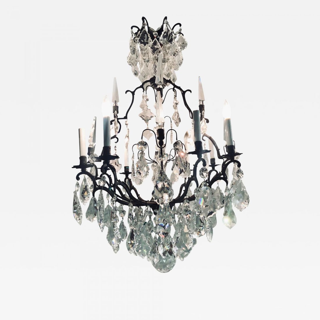 Versailles Chandelier with Swarovski Strass and Crystal Pendants: Title: Versailles Chandelier with Swarovski Strass and Crystal Pendants Description: Versailles chandelier with Swarovski Strass and crystal pendants having a dark brownish almost black iron frame.