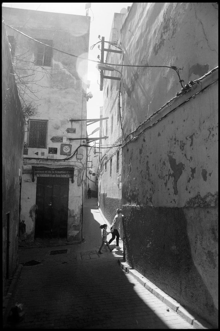Two Young Children, Fes, Morocco - Silver Gelatin: Title: Two Young Children, Fes, Morocco - Silver Gelatin Photograph - Limited Edition of 10Artist: Paul CooklinOrigin: United KingdomMedium: Photography, Gelatin on PaperDimensions: 16 W x 20 H x 0.1
