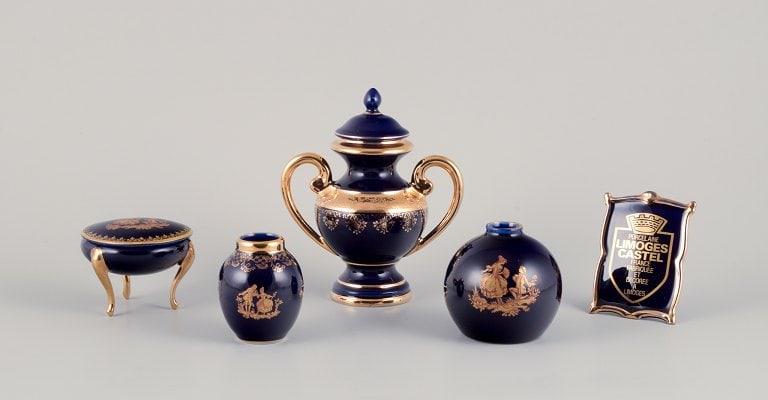 Limoges, France. Five pieces of porcelain consisting of a lidded jar, two vases, a lidded (1 of 9)