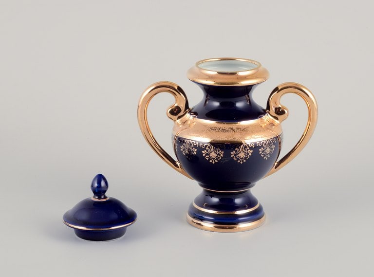 Limoges, France. Five pieces of porcelain consisting of a lidded jar, two vases, a lidded - 3