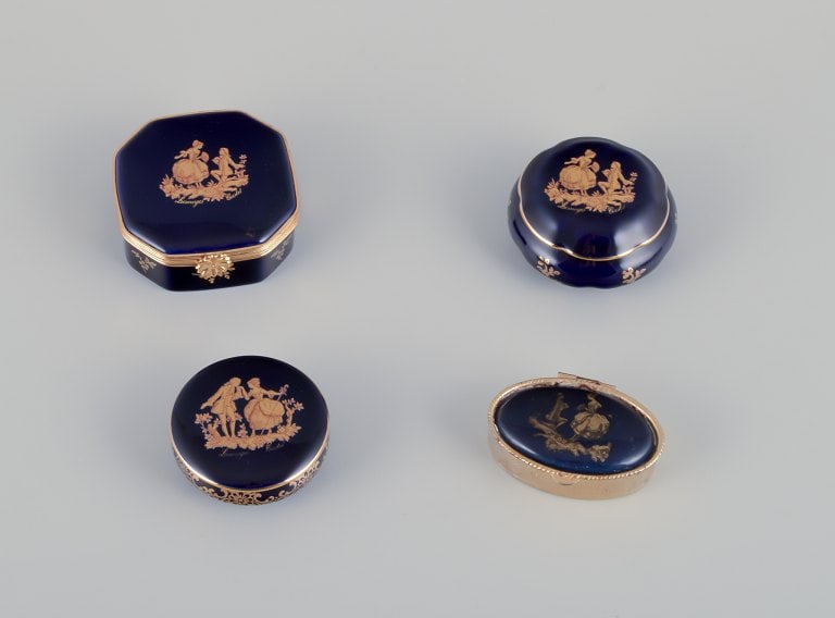 Limoges, France. Four lidded porcelain boxes, two with brass mounts, decorated with 22-karat gold (1 of 9)