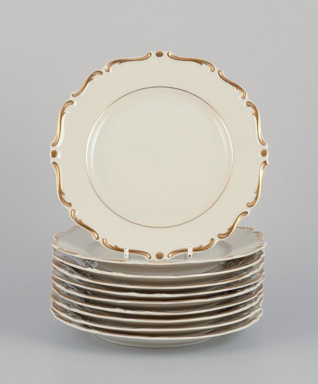 KP, Karlskrona, Sweden. A set of ten cream-colored porcelain plates with gold decoration. (1 of 5)