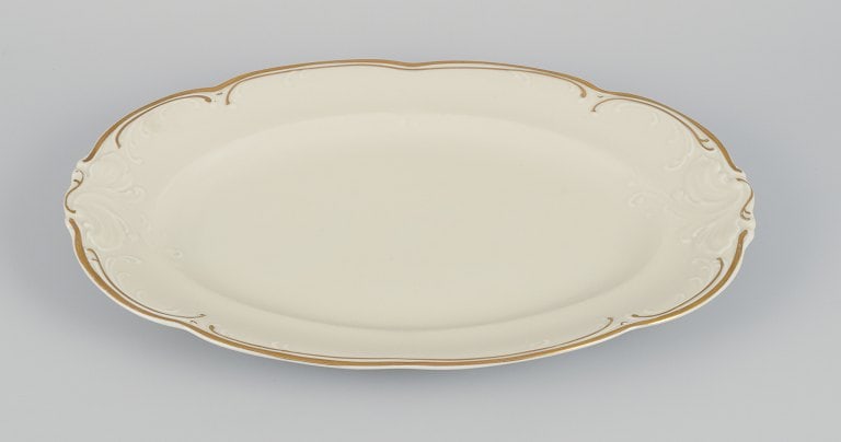 KPM, Poland. Two large oval porcelain serving platters. Cream-colored with gold rim decoration. - 6