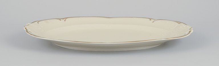 KPM, Poland. Two large oval porcelain serving platters. Cream-colored with gold rim decoration. - 7