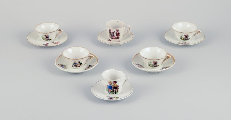 French dolls dinnerware/childrens tea set in porcelain. Six cups with matching saucers. Gold rim. (1 of 9)