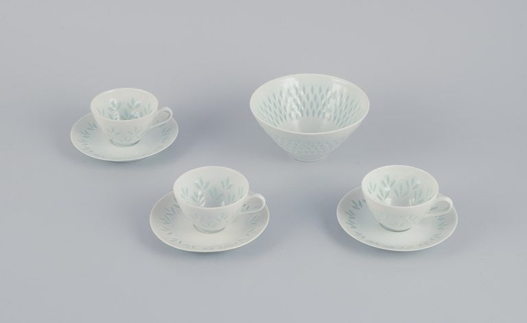 Friedl Kjellberg for Arabia, Finland. A set of three coffee cups with matching saucers and a bowl in: Title:Friedl Kjellberg for Arabia, Finland. A set of three coffee cups with matching saucers and a bowl in rice porcelain.Description:Friedl Kjellberg for Arabia, Finland. A set of three coffee cups