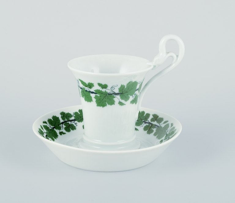 Meissen, Green Ivy Vine, two coffee cups with tall handles shaped like swans.: Title:Meissen, Green Ivy Vine, two coffee cups with tall handles shaped like swans.Description:Meissen, Green Ivy Vine, two coffee cups with tall handles shaped like swans. With saucers. Mid-20th