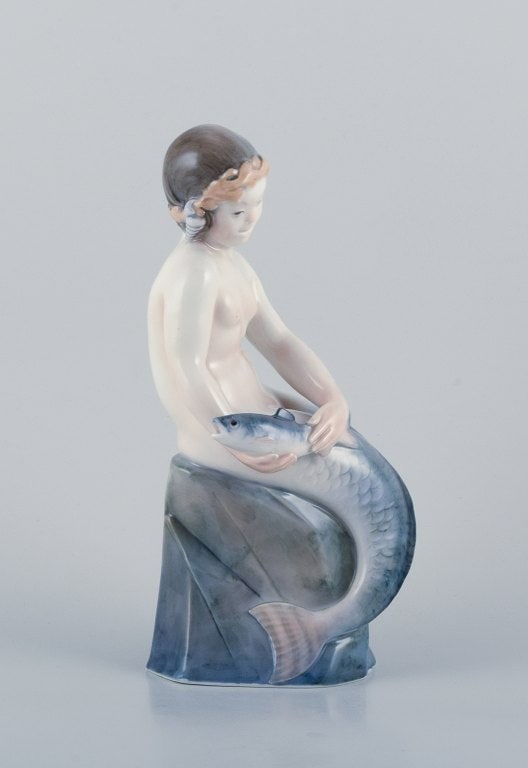 Royal Copenhagen, rare porcelain figurine of a mermaid holding fish in her hands. - 2