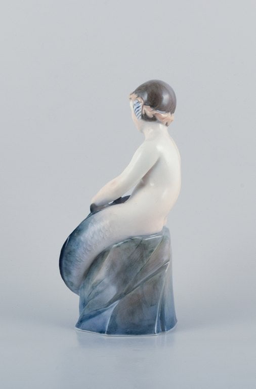 Royal Copenhagen, rare porcelain figurine of a mermaid holding fish in her hands. - 3
