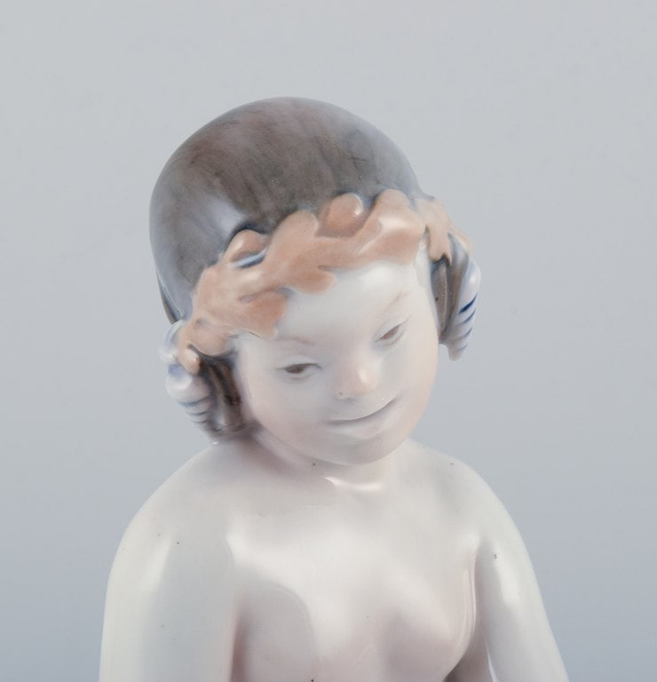 Royal Copenhagen, rare porcelain figurine of a mermaid holding fish in her hands. - 4