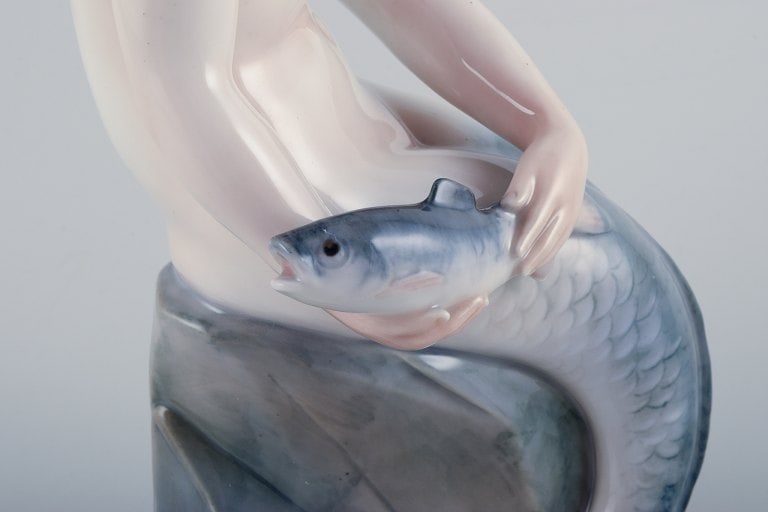 Royal Copenhagen, rare porcelain figurine of a mermaid holding fish in her hands. - 5