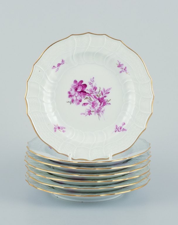 Meissen, Germany. A set of seven porcelain plates hand-painted with purple flower decoration and (1 of 9)