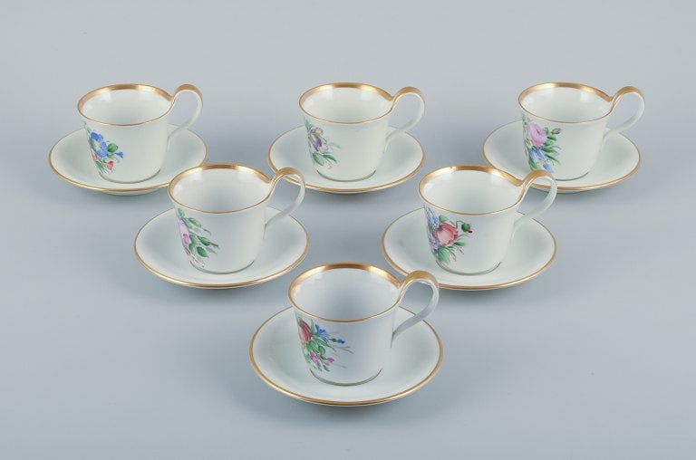 Bing & Grøndahl, a set of six antique coffee cups with high handles and saucers. Hand-painted: Title:Bing & Grøndahl, a set of six antique coffee cups with high handles and saucers. Hand-painted with polychrome flower decoration.Description:Bing & Grøndahl, a set of six antique