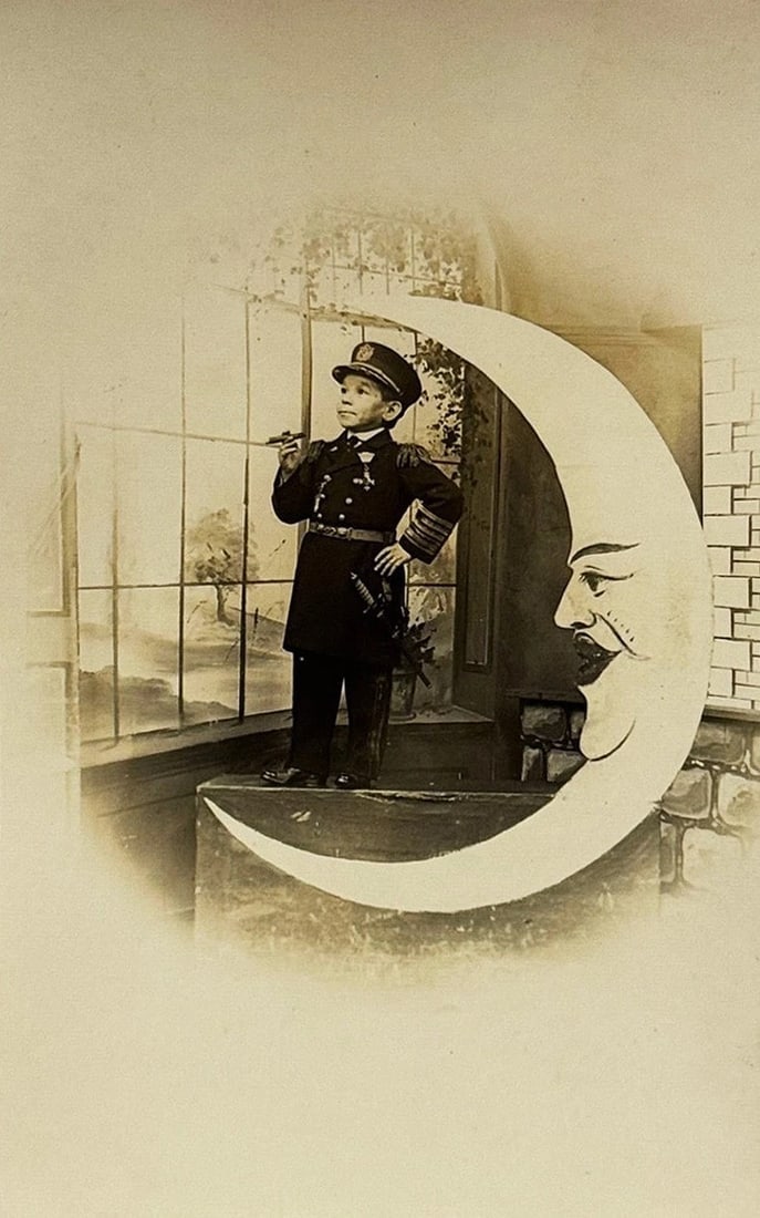 RPPC Real Photo Paper Moon Postcard General Tom Thumb Circus PT Barnum Ex Cond: Real photo paper moon studio image of General Tom Thumb smoking a cigar and posing in his stage uniform complete with sword on a cut-out paper moon. His real name was Charles Stratton and he was