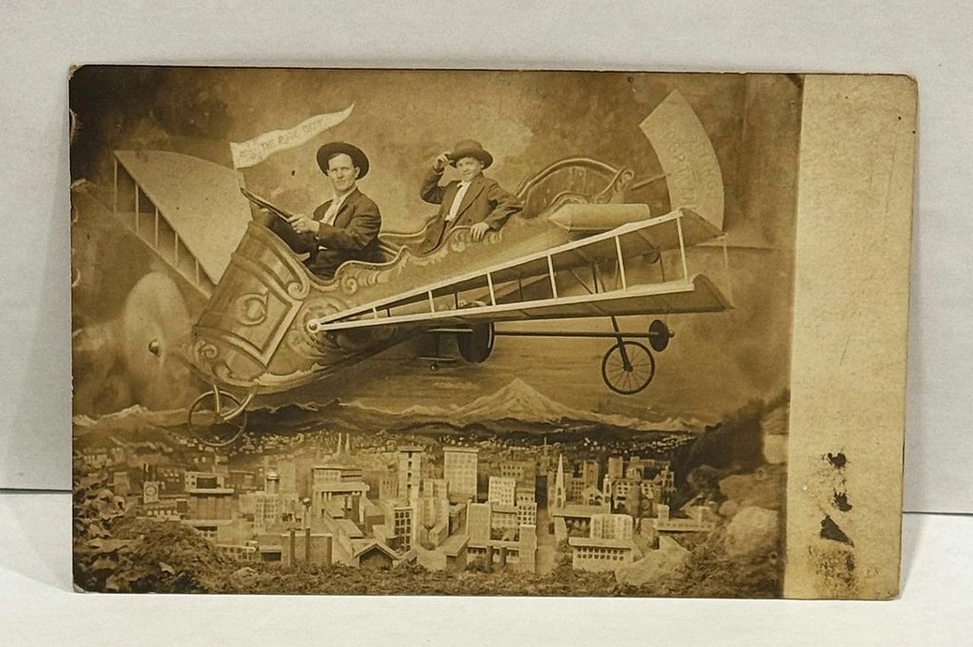 RPPC Real Photo Postcard 2 men in a Fantasy Plane 'The Rose City' Studio 1909 - 2