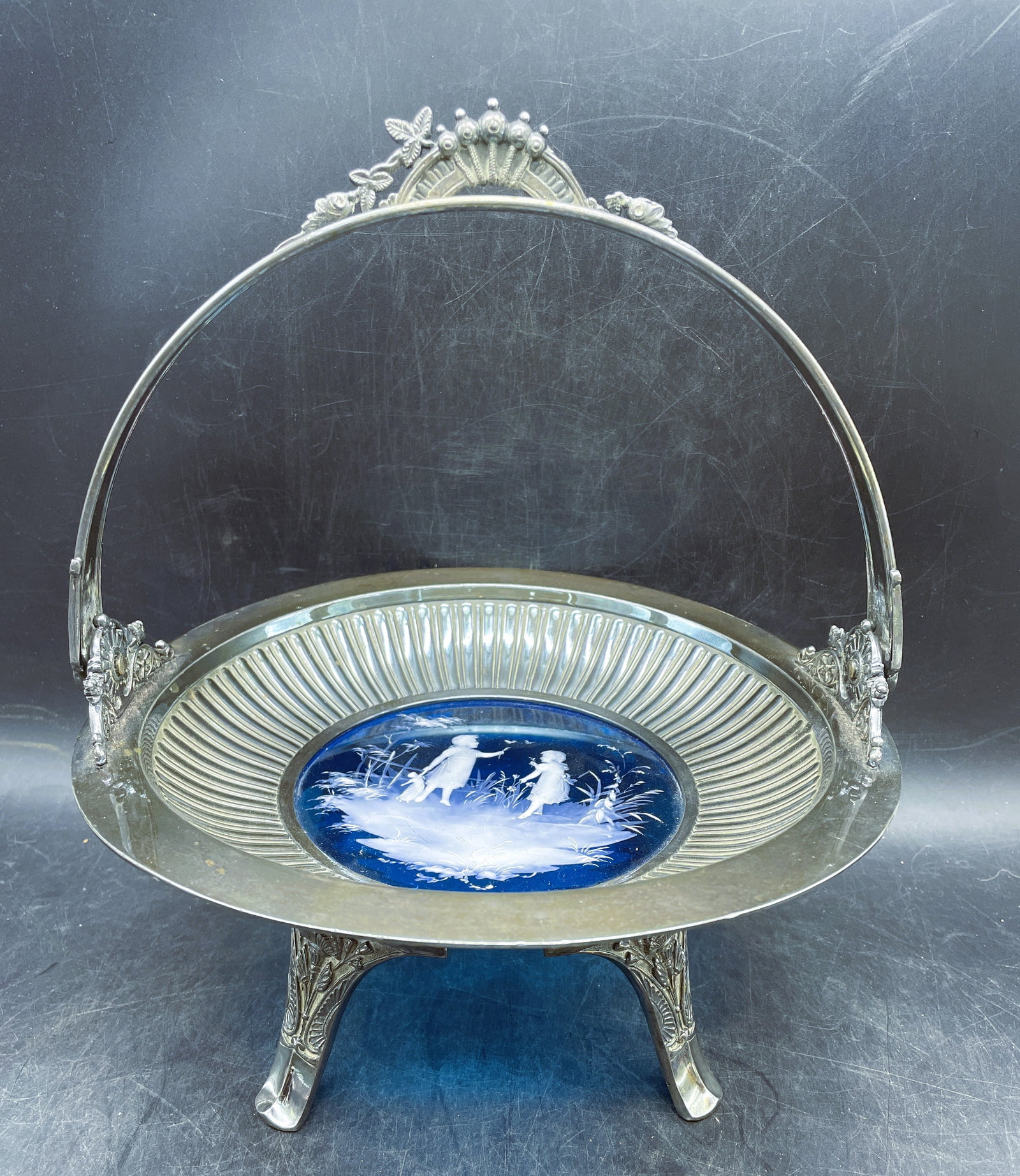 Mary Gregory Silver Plated Bridal Basket Cake Plate c. 1880 Middletown Plate Co.: Date/Period: Approx. late 1800's to early 1900'sDimension: Approx. 10.25" tall handle up, 5" handle down, 9.5" diameterMaterial: silver plate and glassAdditional Information: You are bidding on a