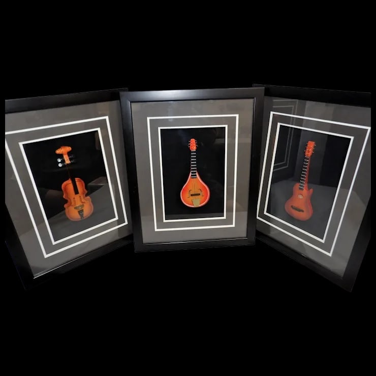 Framed 3D Miniature Musical Instruments: This set of Framed 3D Miniature Musical Instruments is in excellent condition. They make a striking display for the music lover in the family or for a friend. They include a violin, guitar, and