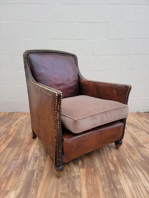 French Art Deco Distressed Leather Lounge Chair: Title: French Art Deco Distressed Leather Lounge Chair Description: Art Deco French Distressed Brown Lounge Chair The lounge is being offered in its original distressed leather with a nicely work pati