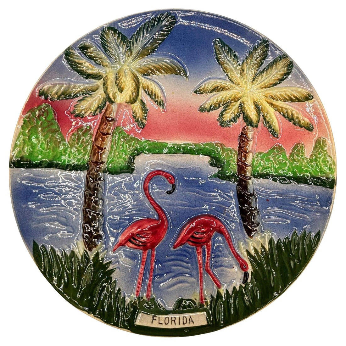 Mid-century Pottery Florida Beach Pink Flamingo Round Decrotive Wall Plate: Title: Mid-century Pottery Florida Beach Pink Flamingo Round Decrotive Wall Plate Description: Mid-century pink and green ceramic flamingo theme decorative wall plate. The wall plate features a