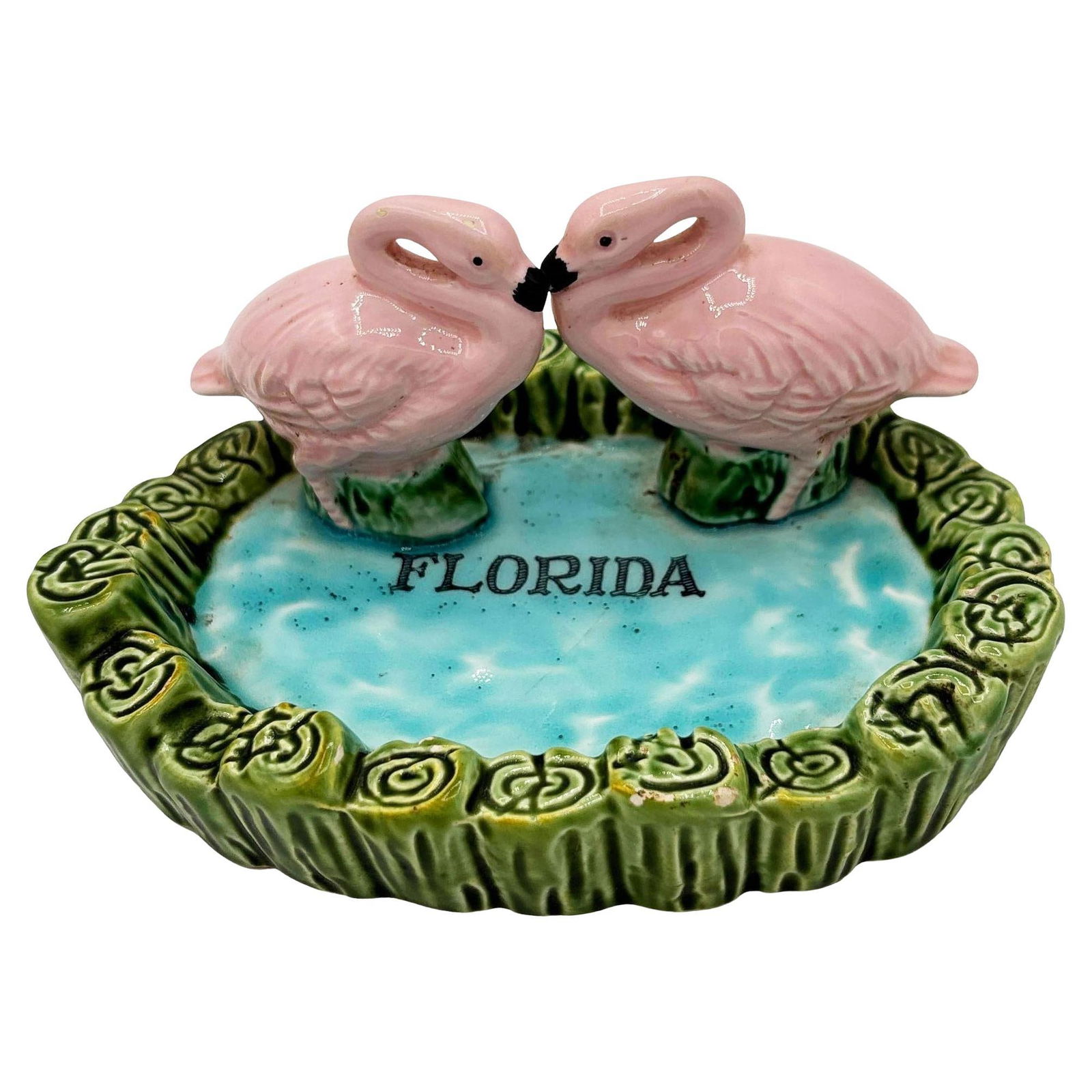 Rare Mid-century Kissing Pink Flamingo Pond Florida Ceramic Ashtray: Title: Rare Mid-century Kissing Pink Flamingo Pond Florida Ceramic Ashtray Description: Mid-century Era hand-painted pink and green ceramic ashtray with two flamingos kissing. The ashtray features a