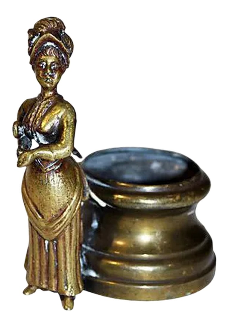 19c Brass Toothpick Holder: An adorable 19c toothpick holder in brass with a spitting image of Mary Poppins. Nice detail. Condition: Condition Notes: Good - Moderate wear and tear, but still has good years left Dimensions: