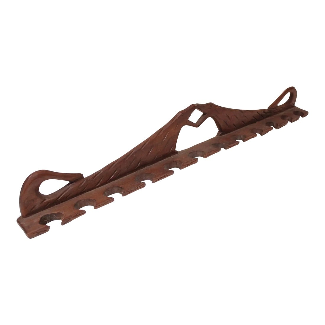 Folk Art Dual Dog Pipe Holder: Hand-carved wooden pipe holder with twelve slots for pipes (circa 1930s, USA). Crude design (figures themselves are ambiguously two dogs meeting at the jaws). Nice patina/age present, but