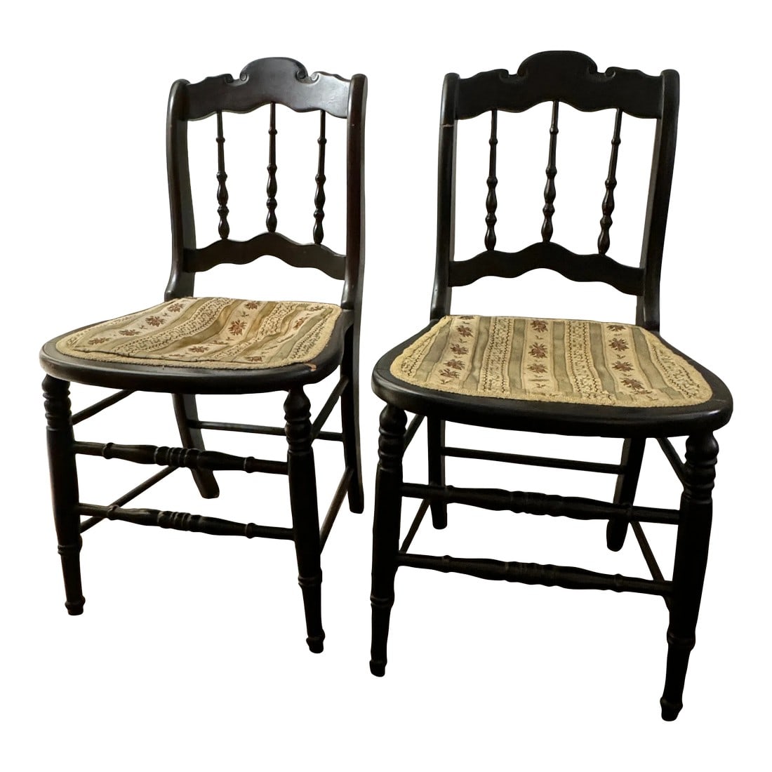 Early 20th Century Antique Spindle Back Upholstered Chairs - Set of 2: These chairs are circa late 19th century or early 20th century. They are delicately upholstered in their original fabric and form. They have spindle backs with wood details on the legs. The upholstere