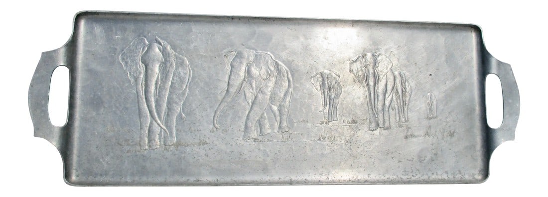 1950s Vintage Elephant Design Aluminum Serving Tray: 1950's Repousse Elephant serving tray in hammered aluminum. Long form shallow tray with cut out handles from single sheet aluminum. 50's style and form in hand hammered original design. Light