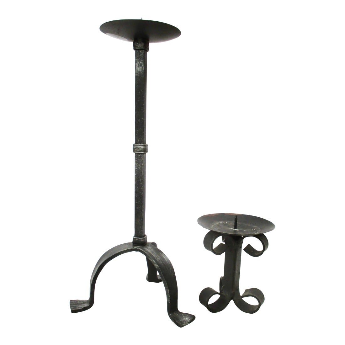 2 Wrought Iron Gothic Candlestands - a Pair of 2: 2 wrought iron candle stands of similar style. Colonial or Gothic-style iron with a blackened patina over the whole. The height is 16" tall and 5.5" tall. 3-legged stands with wide balance and low