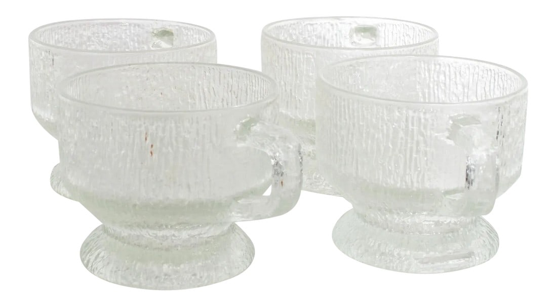 1960s Ice Glass Coffee Mugs After Tapio Wirkkala Iittala: AMBIANIC presents MCM Frosted Ice Glass Mugs Set of Four Ice glass style of Tapio Wirkkala for IITTALA. No label 3.38 H x 5 D x 4 in diameter Original preowned vintage condition. Please review all