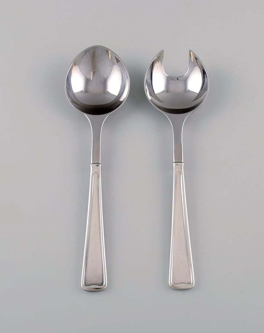 Rare Georg Jensen Koppel cutlery. Salad set in sterling silver and stainless steel.: Title:Rare Georg Jensen Koppel cutlery. Salad set in sterling silver and stainless steel. Description:Rare Georg Jensen Koppel cutlery. Salad set in sterling silver and stainless steel. Length: 22 cm.
