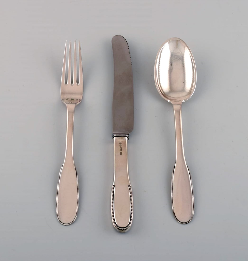 Evald Nielsen number 14 dinner service in hammered silver (830) for six people. 1920s. - 3