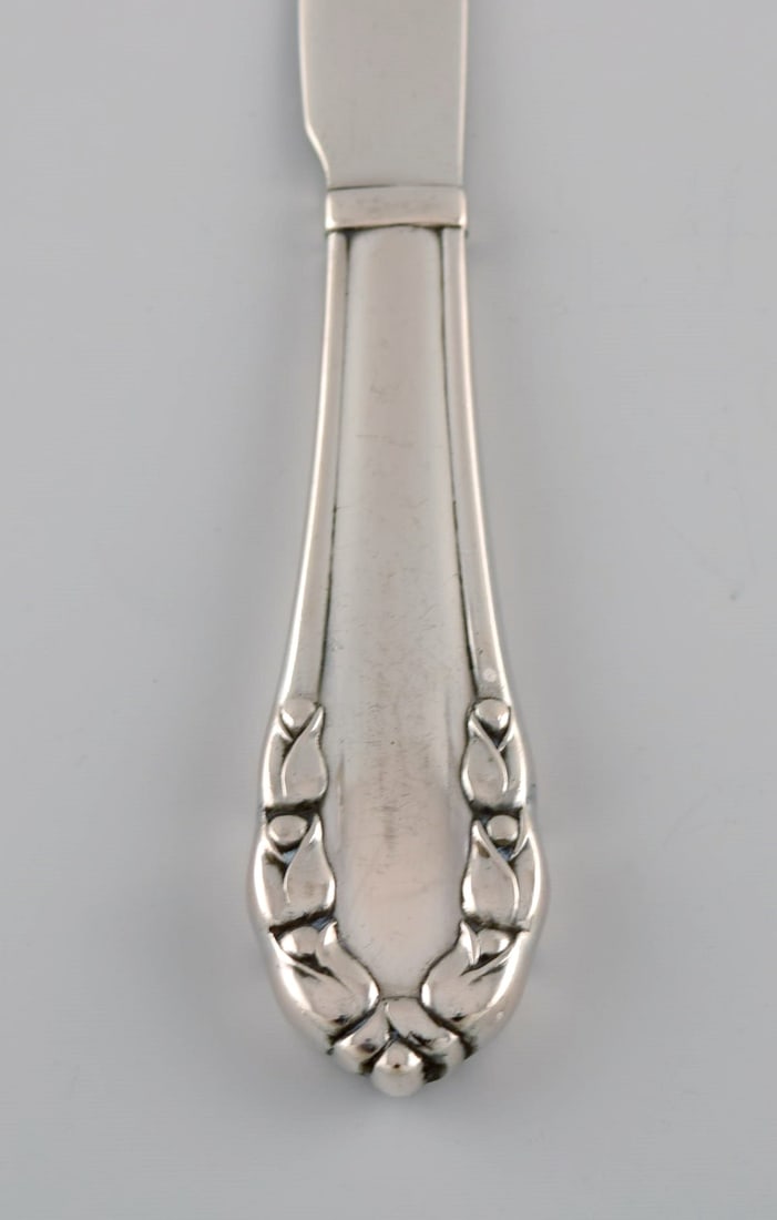 Eight early Georg Jensen Lily of the valley fruit / butter knives in solid silver (830). Dated - 3