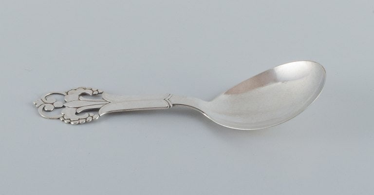 A collection of three silver spoons. - 2