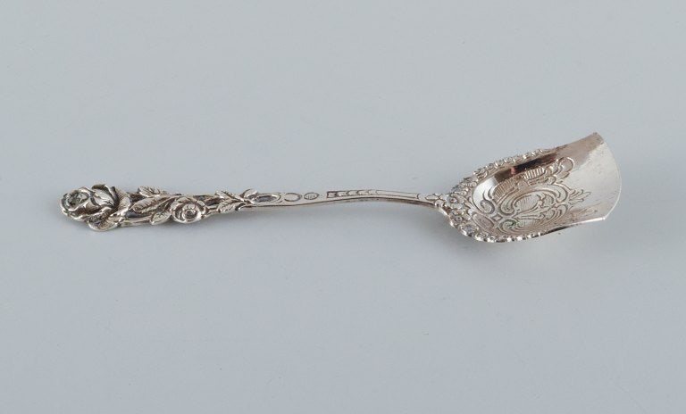 A collection of three silver spoons. - 4