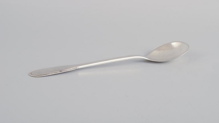 Evald Nielsen, Danish silversmith, two hammered sugar spoons in Danish 830 silver. One spoon model - 3
