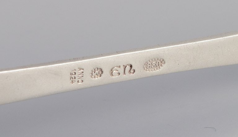 Evald Nielsen, Danish silversmith, two hammered sugar spoons in Danish 830 silver. One spoon model - 6