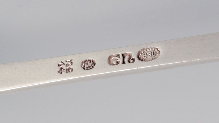 Evald Nielsen, Danish silversmith, two hammered sugar spoons in Danish 830 silver. One spoon model - 7