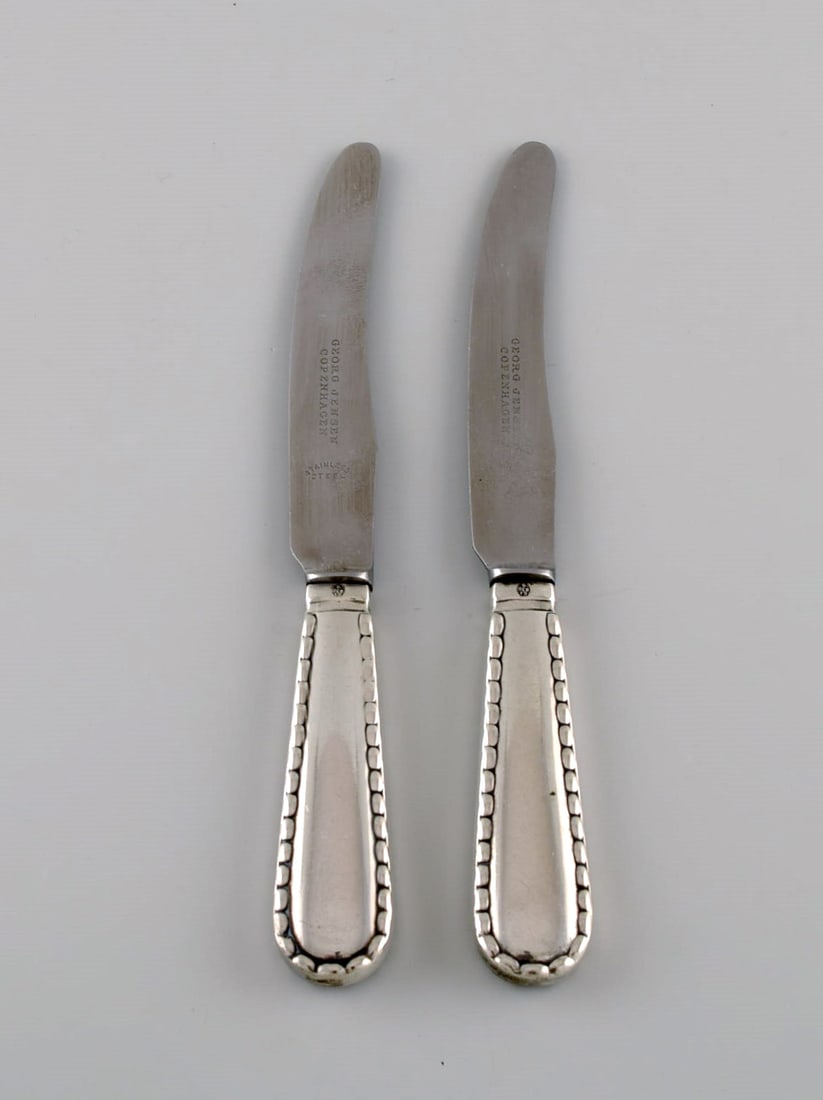 Two early Georg Jensen Rope fruit knives in silver (830) and stainless steel. Dated 1915-1930. (1 of 4)